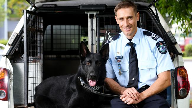 Police Dog Bally this week located six youths who allegedly stole quantities of liquor from a CBD bottle shop before getting into a waiting stolen vehicle. Bally is pictured with his handler Senior Constable Adrian Marek of the Cairns Police Dog Squad. PICTURE: STEWART McLEAN