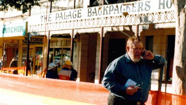 Bill Trevor outside the burnt out building in 2000. Picture: Paul Burtell