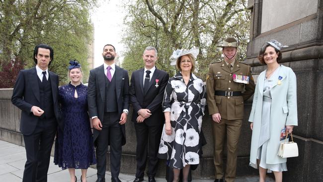 Australians, including Nick Cave and Adam Hills, waiting to go into the ceremony ahead of the coronation of King Charles III. Photo: Ella Pellegrini