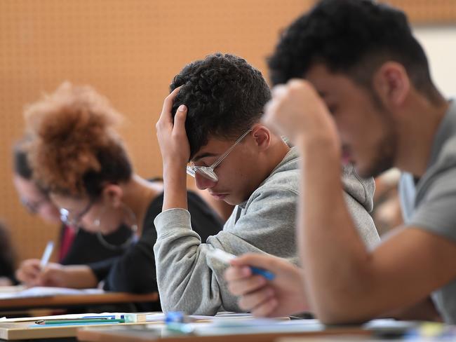 High school students work on a 4 hours philosophy dissertation, that kicks off the French general baccalaureat exam for getting into university, on June 18, 2018 at the lycee Pasteur in Strasbourg, eastern France. / AFP PHOTO / FREDERICK FLORIN