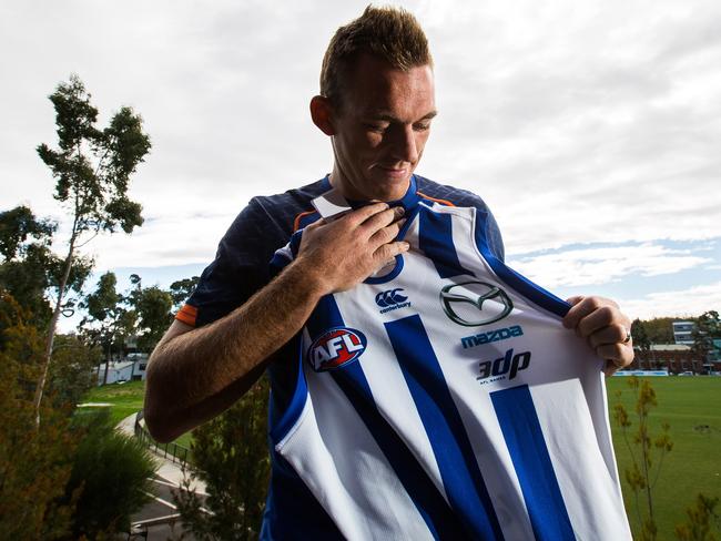 Drew Petrie with the commemorative guernsey North Melbourne will wear for his 300th game. Picture: Getty Images