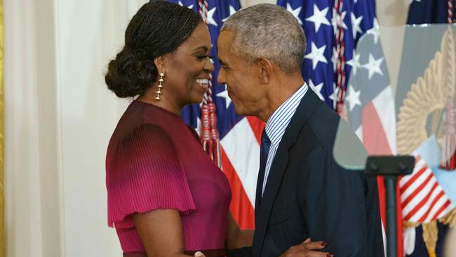 Former US President Barack Obama and wife Michelle Obama embrace during the unveiling of the Obamas’ official White House portraits in the East Room of the White House in Washington, DC on September 7, 2022. Picture: Mandel Ngan/AFP