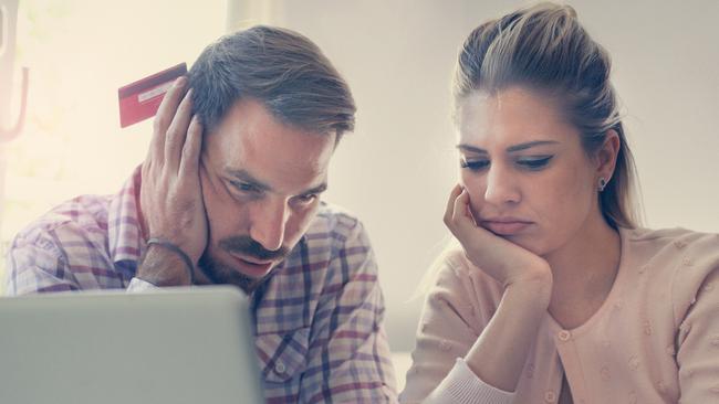 A couple having problem with bills and money. Generic relationships, laptop, expenses. Picture: iStock.