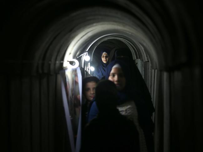 Palestinians walk inside a tunnel used for military exercises during a weapon exhibition at a Hamas-run youth summer camp, in Gaza City, on July 21, 2016. Picture: AFP PHOTO / MOHAMMED ABED