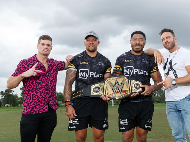 DAILY TELEGRAPH. WWE wrestling stars Grayson Waller (L) & LA Knight (R) with Penrith Panthers players James Fisher-Harris & Moses Leota, after they me with the team and traded them a custom Panthers x WWE championship belt for team jerseys. 16/01/2024. Picture by Max Mason-Hubers