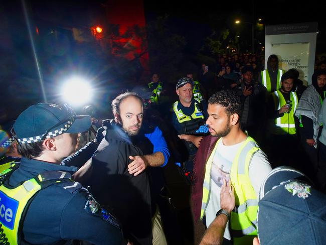 Palestinian protesters scuffle with Jewish men on Monday. Picture: Luis Enrique Ascui