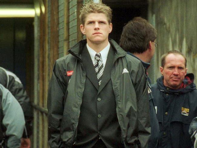 ## HAVE YOU /CHECKED COPYRIGHT /CLEARANCE ?? 28 Sept 2002. Collingwood's suspended Jason Cloke watches the AFL Grand Final. Bris Lions vs Collingwood from the race @ MCG. sport disappointed crowds tunnel
