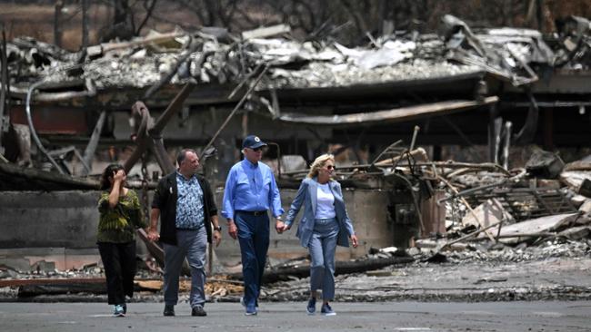 Joe and Jill Biden, right, with Hawaii Governor Josh Green and his wife Jaime visit an area devastated by fires in Lahaina, Hawaii. Picture: AFP