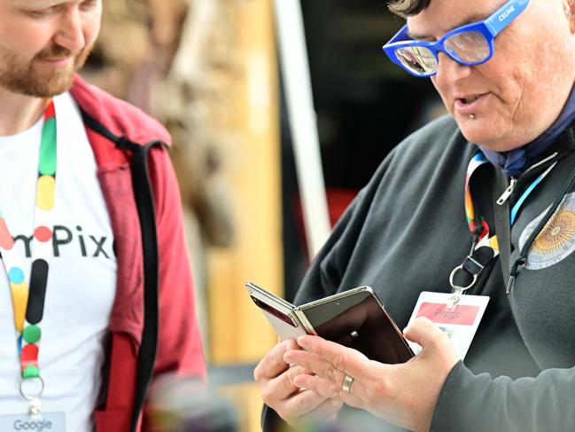 Members of the media view the new Google Pixel Fold phone during a developers conference last year. Picture: AFP