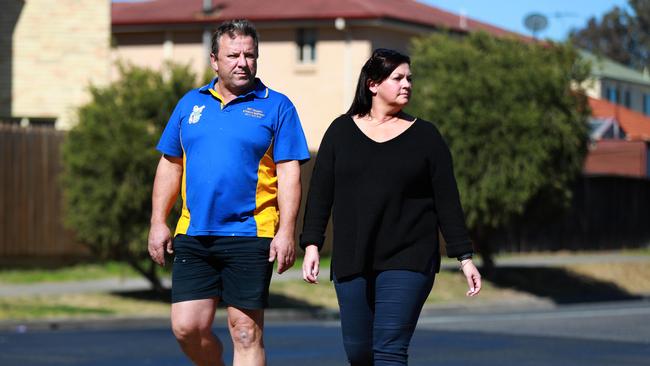 Rouse Hill residents Kelly Zammit and Neil Poullos pose for photographs looking towards the proposed bus depot on Mile End Rd in Rouse Hill Rouse Hill. (AAP Image / Angelo Velardo)