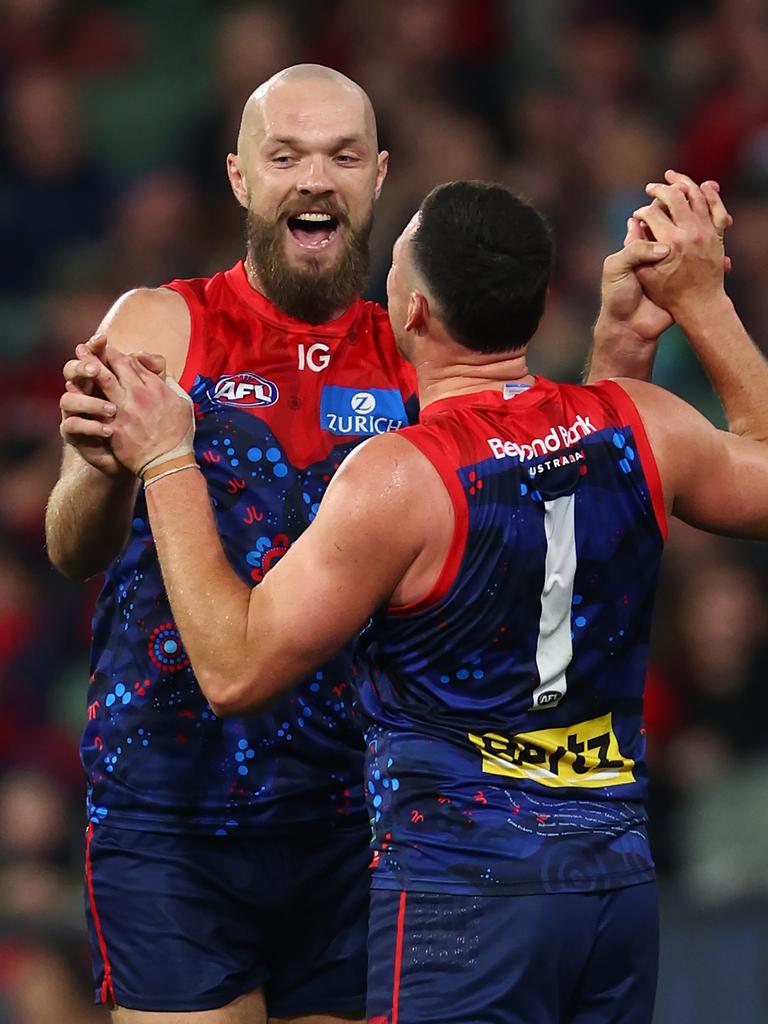 The skipper celebrates a goal with Steven May.