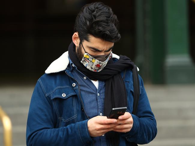 Reusable cloth masks should be washed at least once a day in hot water with detergent. Picture: Getty Images