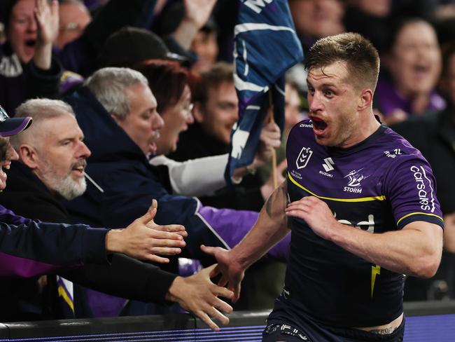 MELBOURNE, AUSTRALIA - SEPTEMBER 27: Cameron Munster of the Storm celebrates after scoring a try during the NRL Preliminary Final match between the Melbourne Storm and Sydney Roosters at AAMI Park on September 27, 2024 in Melbourne, Australia. (Photo by Cameron Spencer/Getty Images)