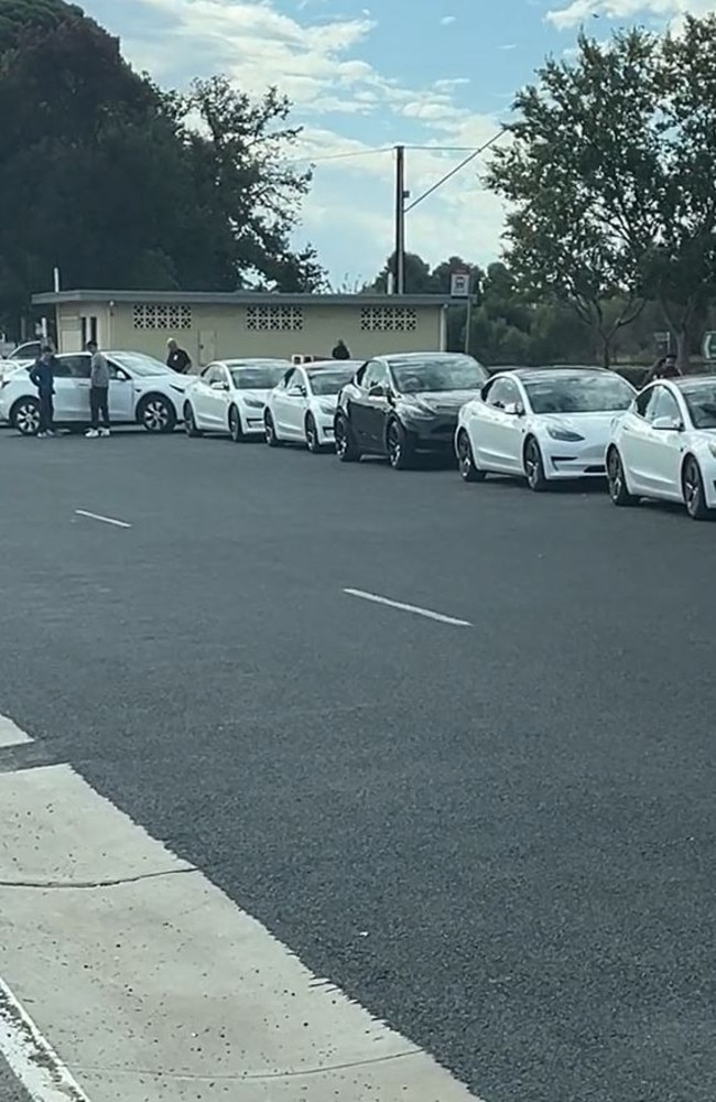 A screenshot of a clip showing a long queue of Teslas waiting for a charging station spot in Keith in rural South Australia. Picture: @pauylyohh83