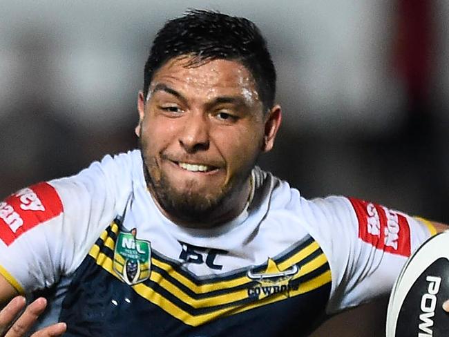 TOWNSVILLE, AUSTRALIA - JUNE 28: Curtis Rona of the Cowboys looks to fend off Dave Tyrell of the Rabbitohs during the round 16 NRL match between the North Queensland Cowboys and the South Sydney Rabbitohs at 1300SMILES Stadium on June 28, 2014 in Townsville, Australia. (Photo by Ian Hitchcock/Getty Images)