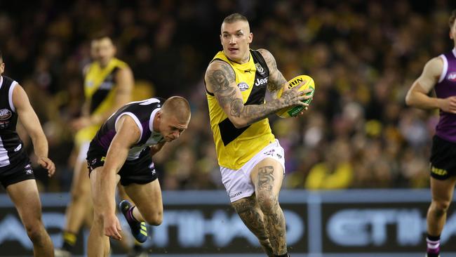 Dustin Martin gives Seb Ross the slip. Picture: Michael Klein