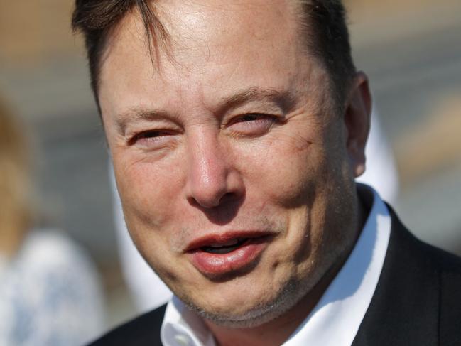 (FILES) In this file photo taken on September 03, 2020 Tesla CEO Elon Musk talks to media as he arrives to visit the construction site of the future US electric car giant Tesla, in Gruenheide near Berlin. - Tesla's third-quarter profits more than quadrupled as the electric auto leader notched sharply higher sales in North America and China, the company said Wednesday. (Photo by Odd ANDERSEN / AFP)