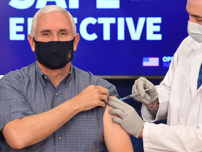 US Vice President Mike Pence receives the COVID-19 vaccine in the Eisenhower Executive Office Building in Washington, DC, December 18, 2020. (Photo by SAUL LOEB / AFP)