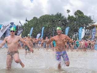 MAIN EVENT: Competitors race in to the water as part of the Noosa Summer Swim.