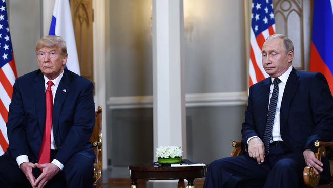 Russian President Vladimir Putin, right, and former president Donald Trump. Picture: Brendan Smialowski/AFP