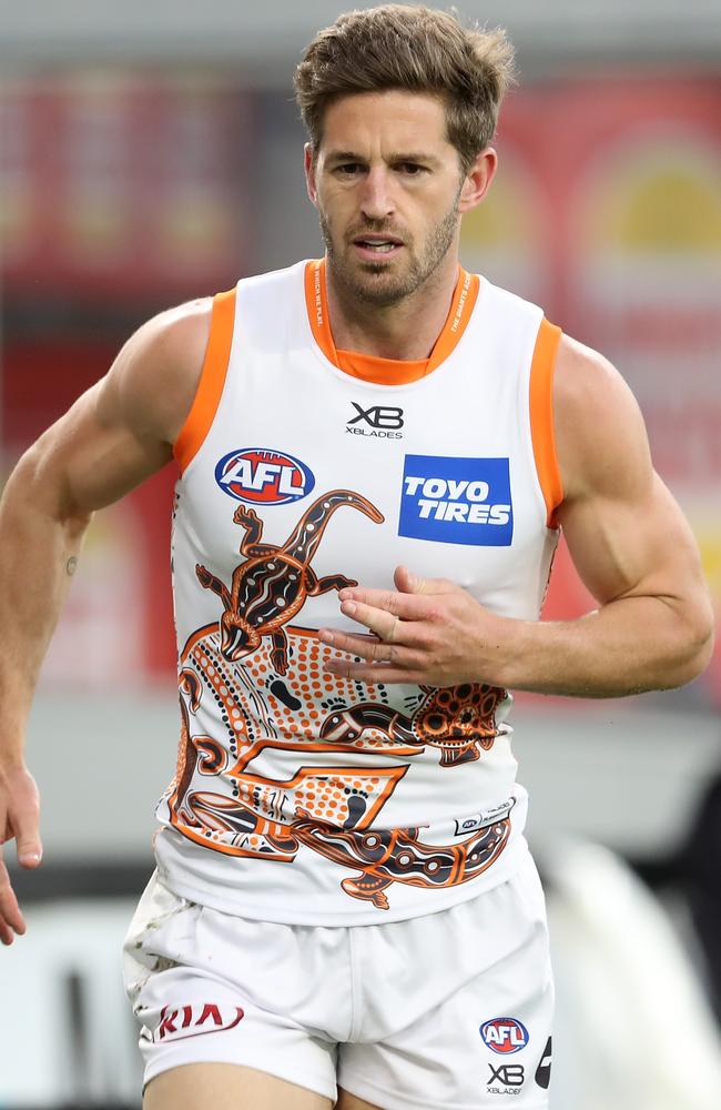 Callan Ward leaves the ground after seriously injuring his finger. No, it’s not meant to bend that way. Picture: Paul Kane/Getty Images