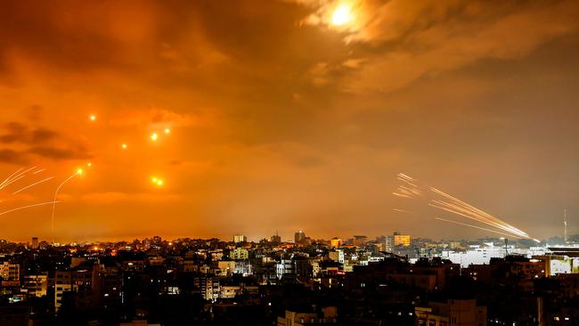 Rockets fired by Palestinian militants from Gaza City are intercepted by the Israeli Iron Dome defence missile system. Picture: AFP