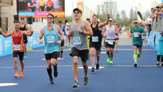 Competitors reach the finish line. Picture Mike Batterham