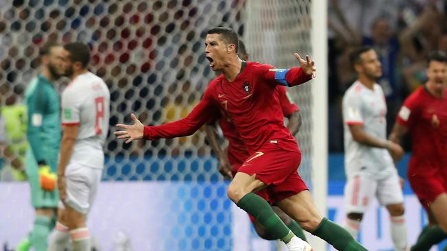 Portugal's Cristiano Ronaldo celebrates after he scored his third goal with a free kick during the group B match between Portugal and Spain at the 2018 soccer World Cup in the Fisht Stadium in Sochi, Russia, Friday, June 15, 2018. (AP Photo/Frank Augstein)