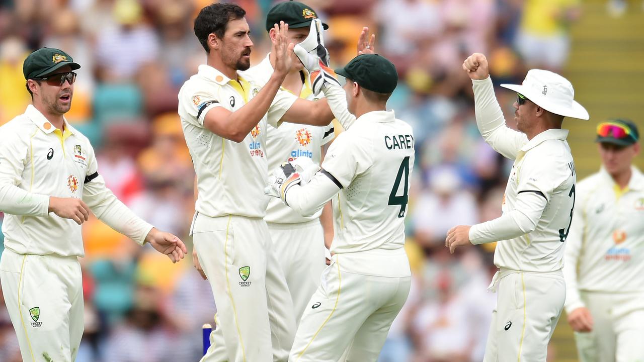 BRISBANE, AUSTRALIA – DECEMBER 17: Mitchell Starc of Australia celebrates taking the wicket of Temba Bavuma of South Africa for 38 runs during day one of the First Test match between Australia and South Africa at The Gabba on December 17, 2022 in Brisbane, Australia. (Photo by Albert Perez/Getty Images)