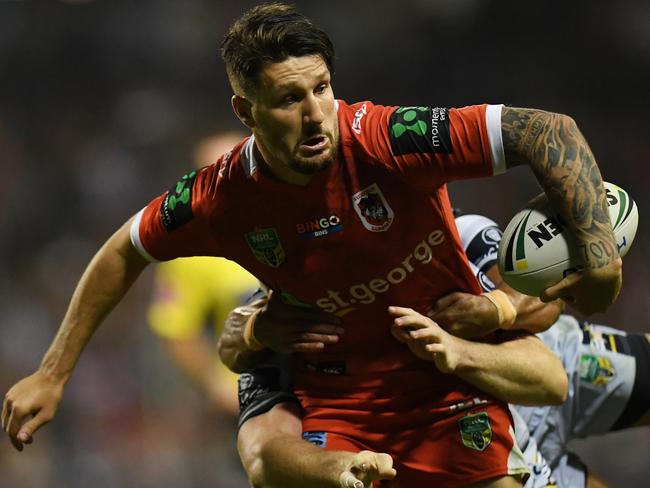Gareth Widdop runs the ball for the Dragons.