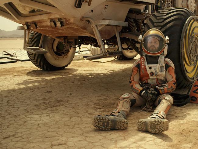 Glass half-full ... Matt Damon as stranded Mars astronaut Mark Watney.