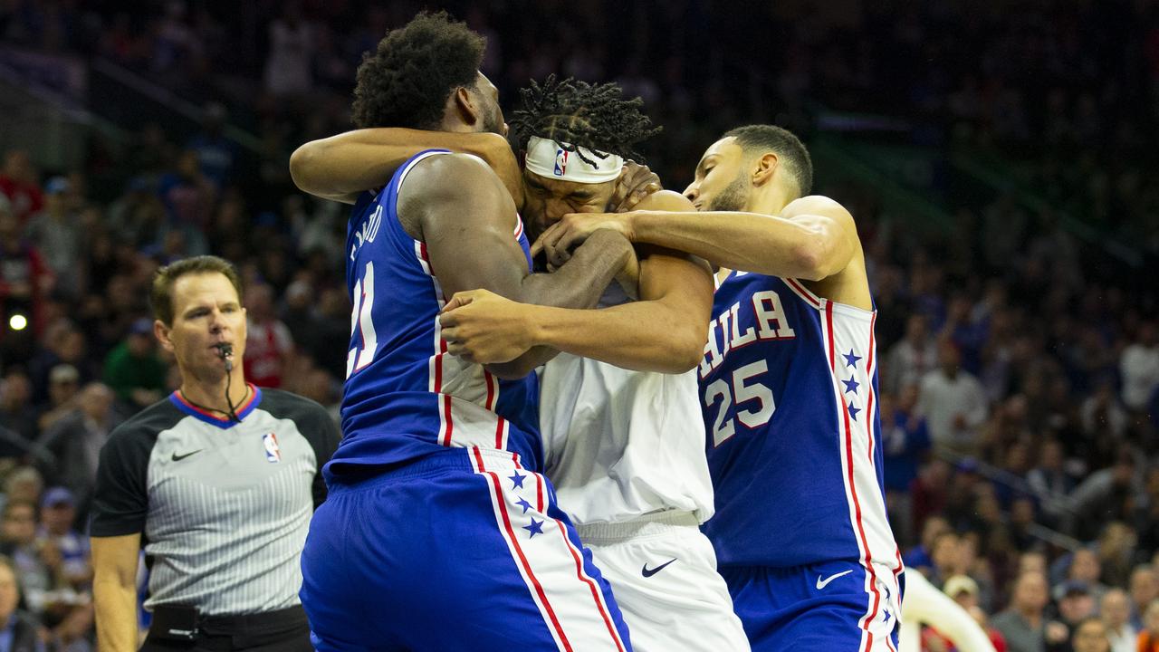 Ben Simmons grabs Karl Anthony Towns during a wild brawl between the 76ers and Timberwolves.