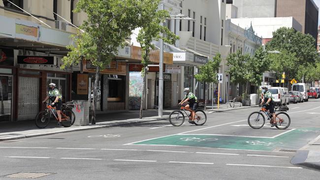 Police patrol an empty Perth CBD on Wednesday. Picture: Philip Gostelow