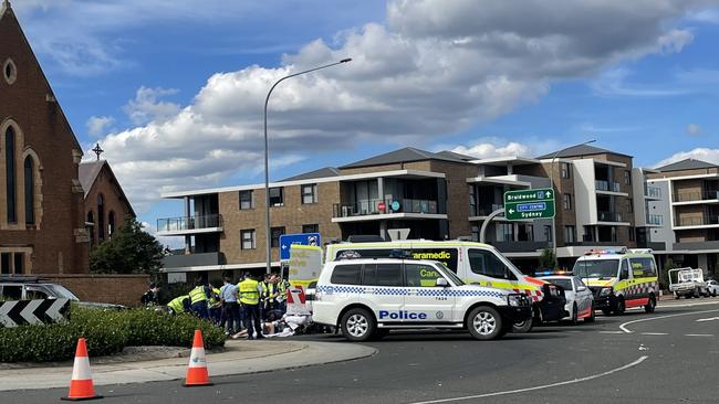 Police and paramedics work to stabilise a man injured in a two-vehicle car crash on the intersection of Bourke and Clinton Street, Goulburn. Picture: Niki Iliagoueva