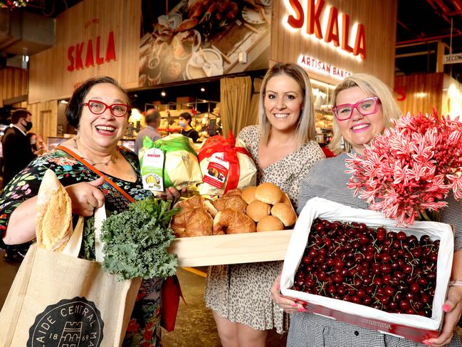 Adelaide Central Markets is teaming with Catherine house to provide fresh produce for Christmas Day lunch for vulnerable women. (LtoR) Rosa Matto, Tanya Papa, (Retail Manager for Skala Bakery), and Jaylee Cooper, did the rounds of the market to get some of the produce for the feast. 21 December 2021. Picture Dean Martin