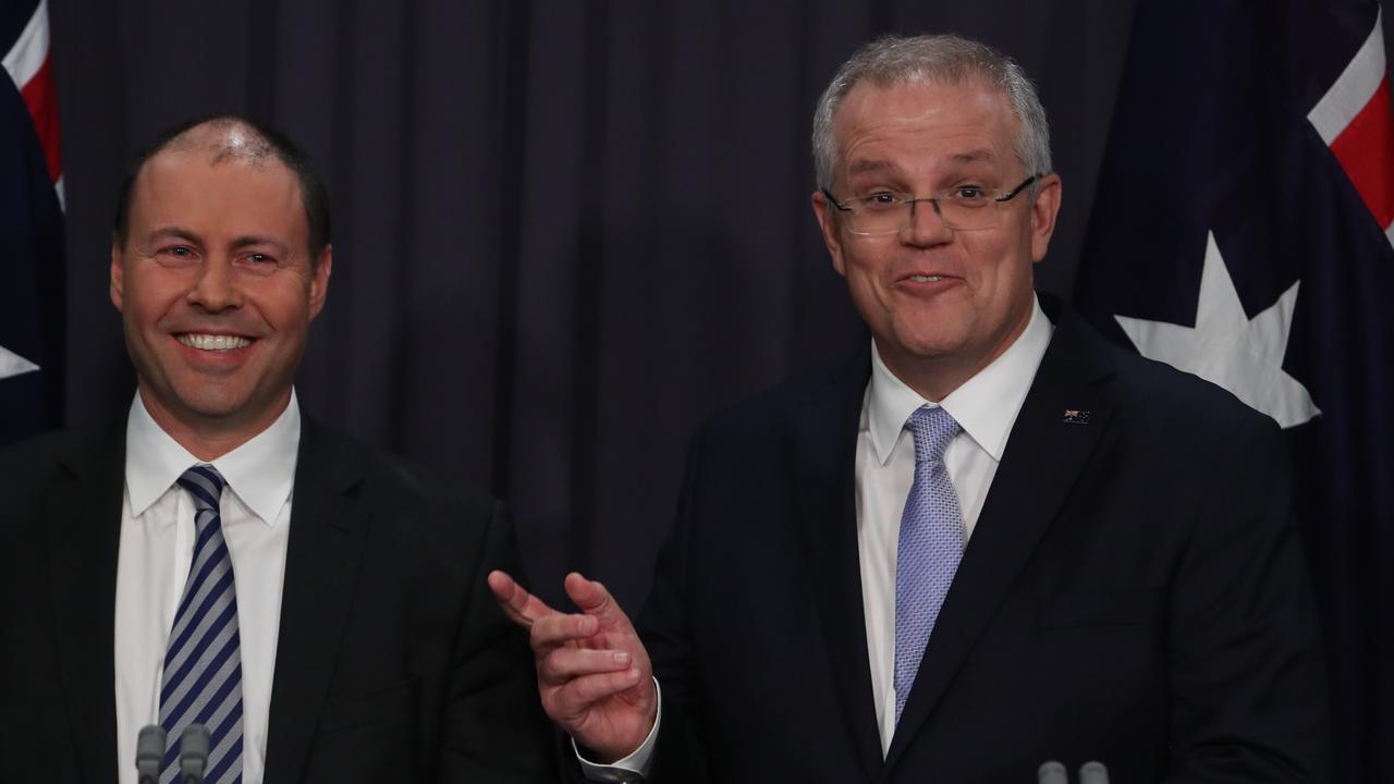 Josh Frydenberg and Scott Morrison holds a press conference in the Blue Room in Parliament House, Canberra.