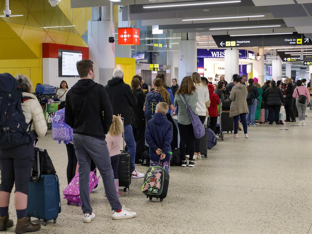 Passengers queued at the Jetstar terminal in Melbourne Airport as conditions slowly returned to normal after global outage. Picture: Ian Currie