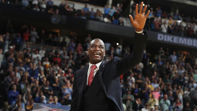 Retired Denver Nugget Dikembe Mutombo waves to the crowd as his jersey number was retired by the team on the weekend. Picture: AP Photo