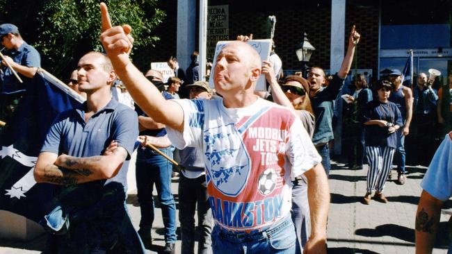 A man shouts racist slogans at a larger group of people, including returned servicemen, at an anti-racism rally in Prospect in 2011.