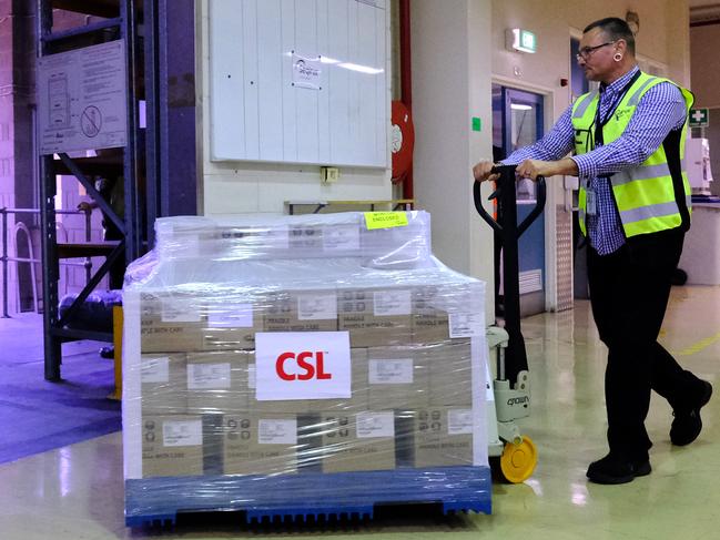 MELBOURNE, AUSTRALIA - MARCH 24: Workers at CSL roll out onto a truck the first batch of the AstraZeneca vaccine on March 24, 2021 in Melbourne, Australia. Pharmaceutical company CSL has released Australia's first locally made doses of the AstraZeneca COVID-19 vaccine. The 830,000 doses released today follows the completion of the final stages of manufacture - known as fill and finish - and extensive quality checks and approval by Australia's Therapeutic Goods Administration. A further 2.5 million doses are currently in cold storage, undergoing the final stages of testing, approval and release and will be distributed in the coming weeks. (Photo by Luis Ascui/Getty Images)