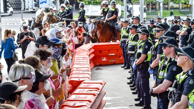 Climate change activists come up against police at the IMARC conference at the Melbourne Exhibition Centre. Picture: Jake Nowakowski.