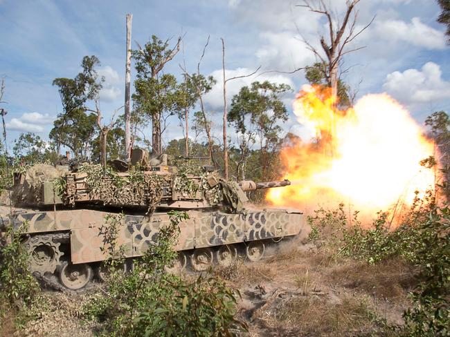 An Australian Army 1st Armoured Regiment M1A1 Abrams tank fires a 120mm round from its main gun. Picture: ADF