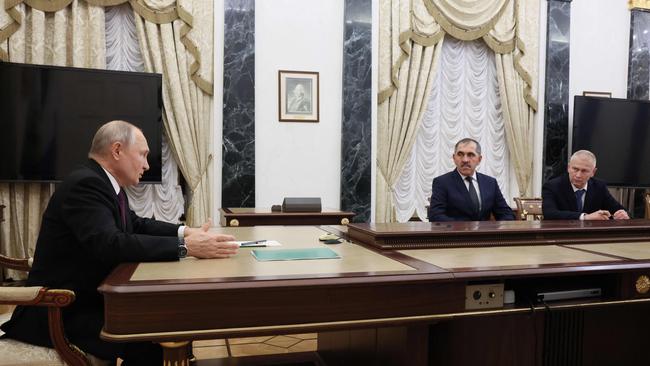 Vladimir Putin meets with Russian Deputy Defence Minister Yunus-Bek Yevkurov and Andrei Troshev. Picture: AFP