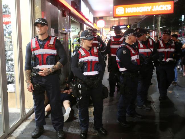 Police in Swanston Street. Picture Yuri Kouzmin