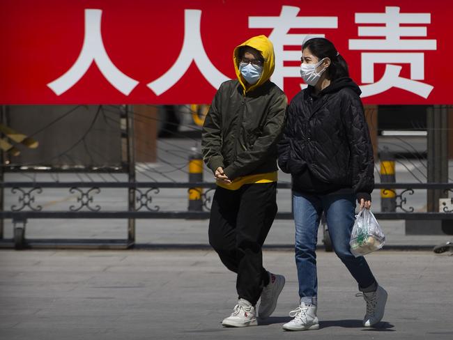 People wearing face masks in Beijing. Picture: AP