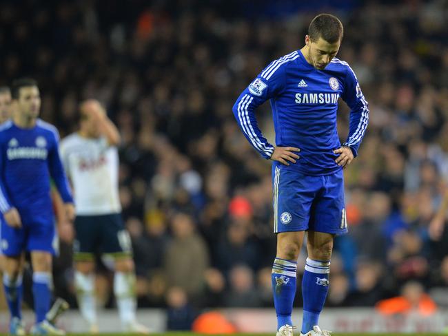 Chelsea's Belgian midfielder Eden Hazard (C) reacts at the final whistle in the English Premier League football match between Tottenham Hotspur and Chelsea at White Hart Lane in London on January 1, 2015. Tottenham won the game 5-3. AFP PHOTO / GLYN KIRK == RESTRICTED TO EDITORIAL USE. NO USE WITH UNAUTHORIZED AUDIO, VIDEO, DATA, FIXTURE LISTS, CLUB/LEAGUE LOGOS OR “LIVE” SERVICES. ONLINE IN-MATCH USE LIMITED TO 45 IMAGES, NO VIDEO EMULATION. NO USE IN BETTING, GAMES OR SINGLE CLUB/LEAGUE/PLAYER PUBLICATIONS. ==