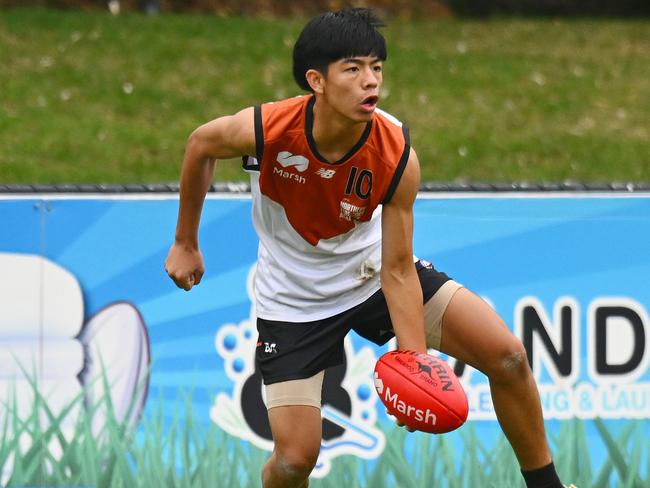 Hau-Tze Rock of the Northern Territory handballs during the AFL 2024 Under 16 Boys Championships match between Northern Territory and Tasmania at Trevor Barker Beach Oval on June 8, 2024 in Melbourne, Australia. Picture: Morgan Hancock/AFL Photos