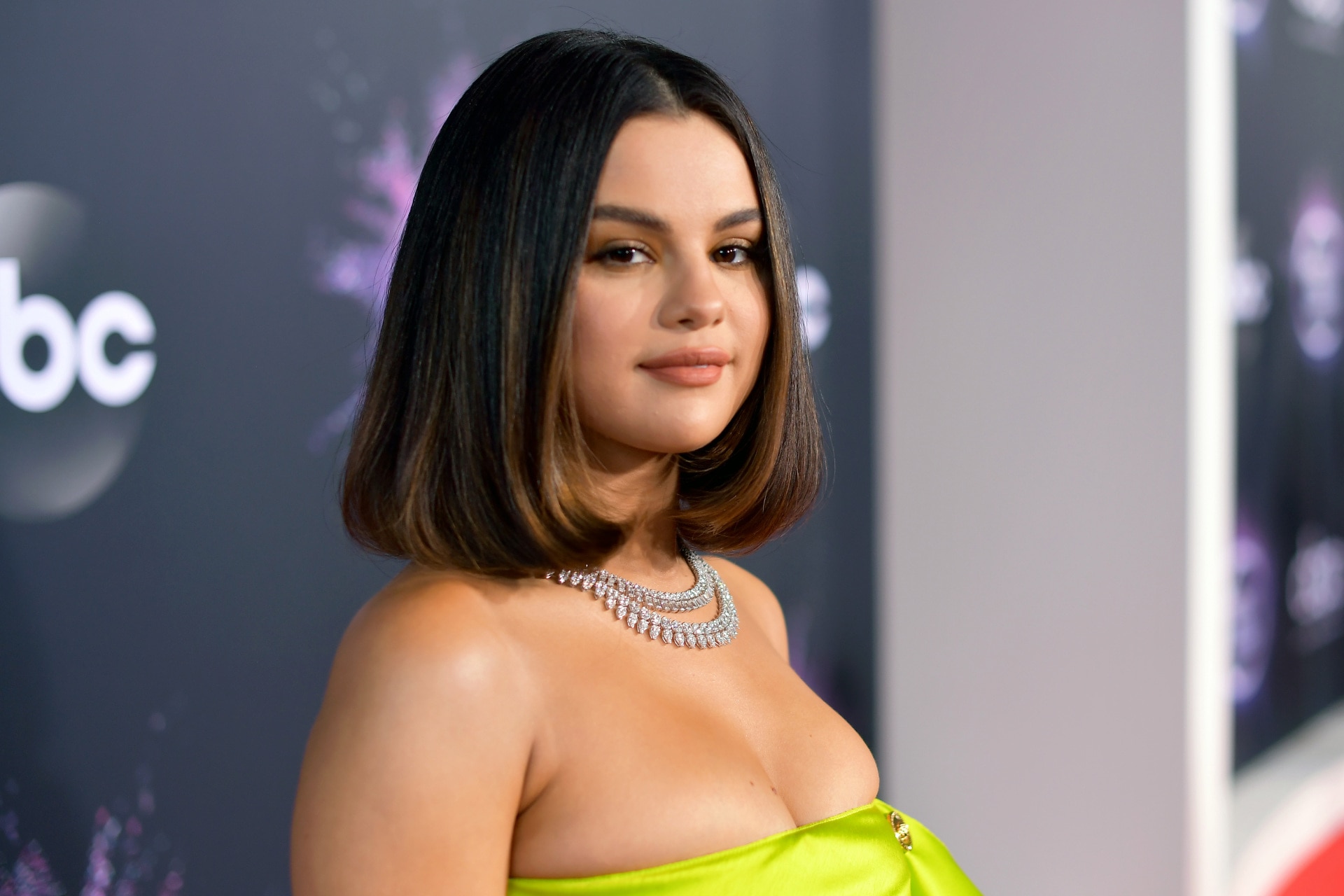 Selena Gomez Embraces No-Bra Trend Chic Yellow Crop Top & Pumps