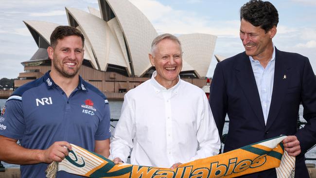 Schmidt (C) stands with former Australian captain John Eales (R) and current Wallaby, NSW WaratahDavid Porecki, at the official announcement of tickets on sale for the 2025 British and Irish Lions Tour. Picture: David Gray / AFP