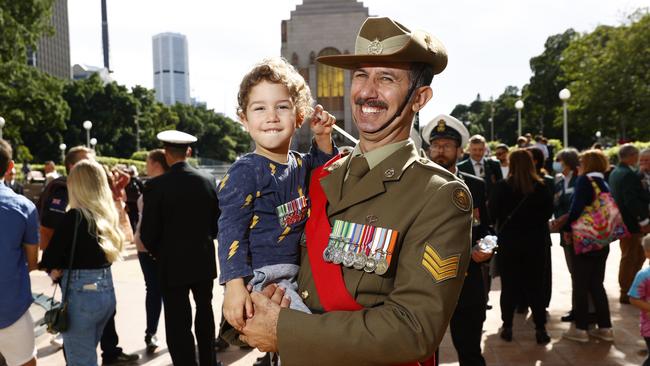 Chris Hayden from the Australian Amphibious Force with his 3-year-old son Paul. Picture: Richard Dobson